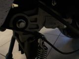 a close up view of a motorcycle ' s front suspension