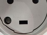 a close up of a white electrical outlet on a wall