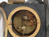 a clock that is sitting on top of a table