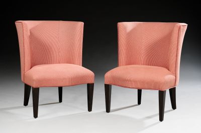 pair of pink upholstered chairs with black legs