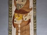 an image of a rug with a picture of a woman and a child