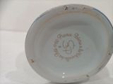 a close up of a white bowl with writing on it