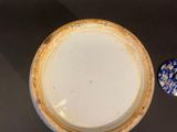 a bowl and a spoon sitting on a table