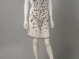 a mannequin dress with black and white flowers on a mannequin