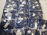 a lot of blue shirts that are on the table