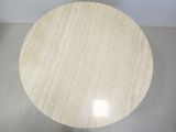 beige marble table top with a circular base