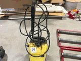 a yellow machine that is sitting on the floor
