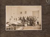 an old photo of a group of people in a hospital room