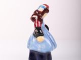 a figurine of a man riding a horse on top of a snowboard