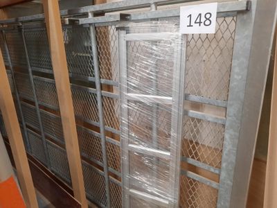 a metal gate with a number on it in a warehouse