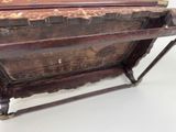 a very old wooden box that is sitting on a table