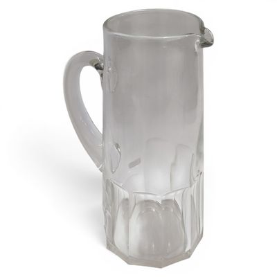 a clear glass pitcher with a handle on a white surface
