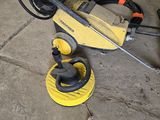a power washer sitting on the floor next to a hose