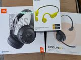 two boxes of headphones sitting on top of a cardboard box