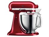 a red kitchenaid mixer on a white background