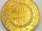 a gold coin with the inscription 20 frans on it