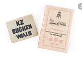 two books on a white surface with a light house in the background