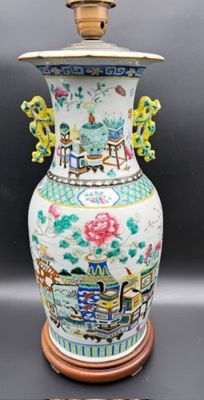 a vase that has a lid on it on a table