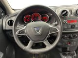 the interior of a car with a steering wheel and dashboard controls