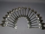 a lot of spoons arranged in a circle on a table