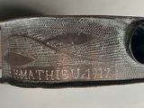 a close up of a metal belt with a metal buckle on it