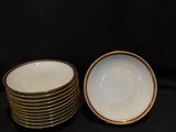 several plates are stacked on top of each other on a black background