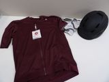 a hat and a shirt on a table next to a hat