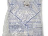 the shirt is wrapped in plastic and ready to be worn