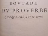 an old book with writing on it sitting on top of a table