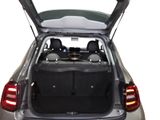 the back of a car with its trunk open and the back seats folded down