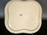 an image of a white plate sitting on top of a black table