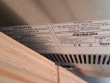 a label on the back of a refrigerator that is not in use