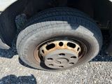 a close up of a flat tire on a flatbed truck