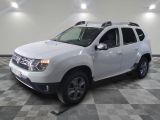 a picture of a white dacia parked in a garage