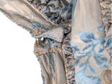 an image of a close up of a blue and silver dress