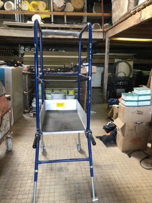 an image of a kitchen with a ladder in the middle of the room