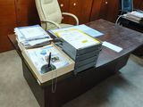 a desk with a lot of books on it