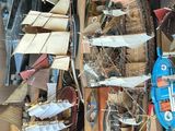 a large pile of assorted items in a cardboard box