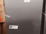 two refrigerators that are on display in a store