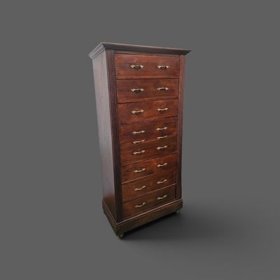 a wooden chest of drawers on a gray background