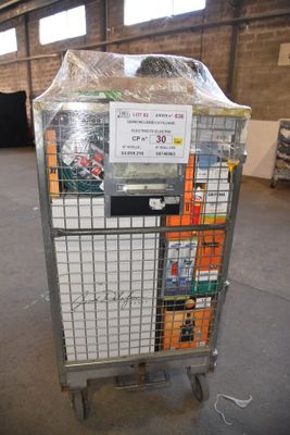 a metal cart with a sign on it in a warehouse