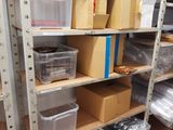 many boxes and boxes on the shelves in the room
