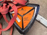 an image of a safety device on the ground next to a piece of equipment