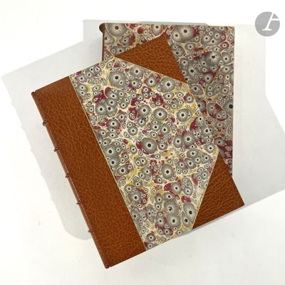 a small book with a floral pattern on it