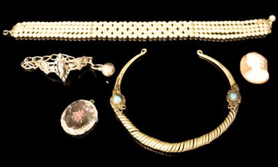 several pieces of jewelry including a necklace, bracelet, and ring