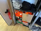 a closet with a lot of clothes on the shelves
