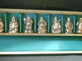 an image of a display case filled with silver figurines of buddhas