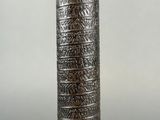 an image of a tall vase that has a pattern on it