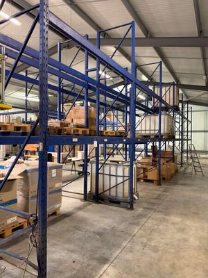 a large warehouse filled with lots of boxes and pallets
