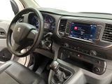 the interior of a car with a steering wheel, dashboard, and dashboard controls